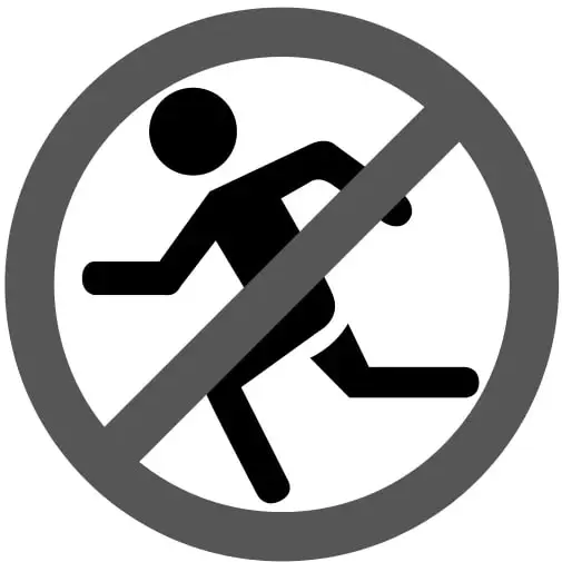Señal circular de prohibición: círculo gris con barra diagonal que tacha la silueta negra de una persona corriendo.