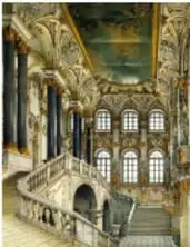 Fachada de una iglesia barroca con columnas y frontón curvo, vista desde la plaza.