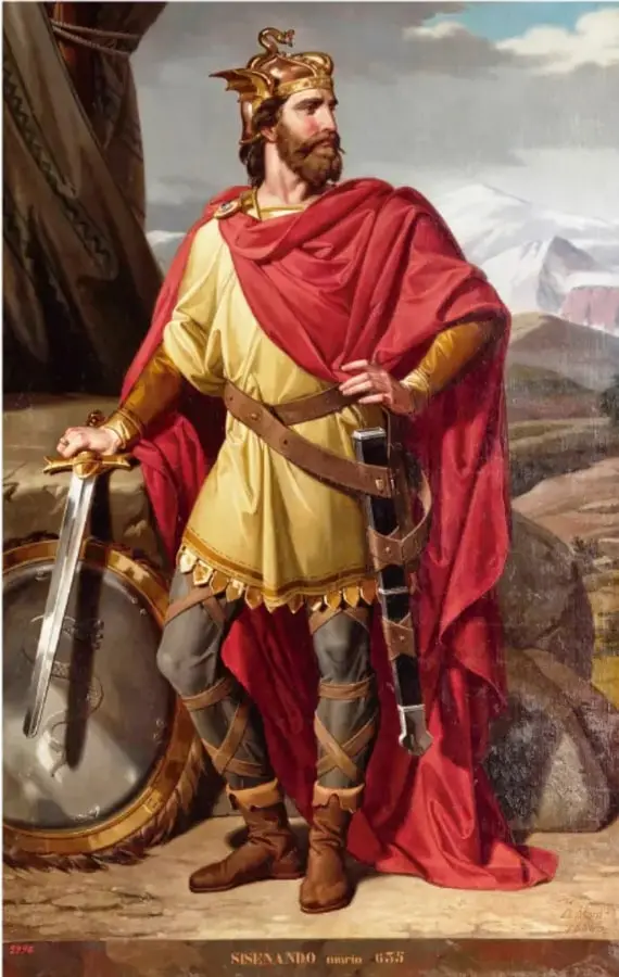 Pintura de un rey germánico de pie, con corona alada, capa roja, túnica amarilla, espada y escudo, en un paisaje montañoso. En la parte inferior se lee 'NISENANDO, marzo 655'.