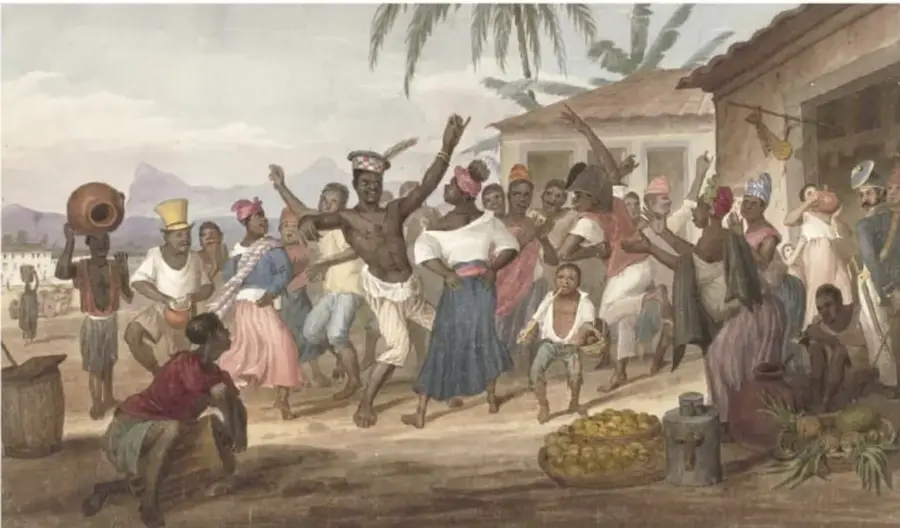Pintura costumbrista que muestra a un grupo de personas afrodescendientes bailando y celebrando en una calle, con instrumentos musicales, cántaros y frutas; refleja la vida comunitaria y los rituales traídos de África.