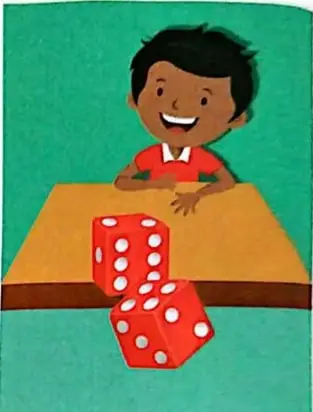 Niño lanzando dados sobre una mesa.
