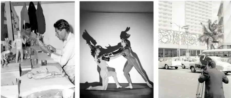 Fotografía en taller: creador trabajando figuras y vestuarios sobre una mesa, con maniquíes al fondo (escultura/diseño).