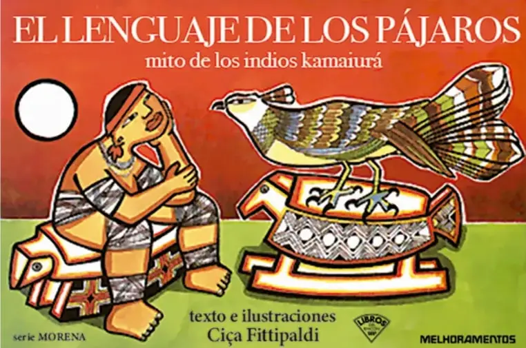 Portada del libro 'El lenguaje de los pájaros, mito de los indios kamaiurá'. Muestra a un indígena sentado y a un pájaro sobre un objeto decorado, con fondo rojo y verde. Incluye el nombre de la autora, Ciça Fittipaldi, y el sello de la editorial Melhoramentos.
