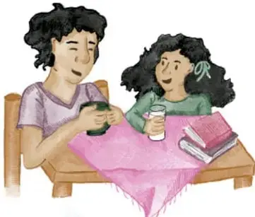 Dos niñas sentadas en una mesa con manta rosa, leyendo libros y tomando bebidas.