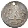 Fotografía del anverso de una moneda de plata de Carlos IV, 1/4 Real, México, 1797, de 11 mm, Colección Casa de Moneda de México, Museo Numismático Nacional.