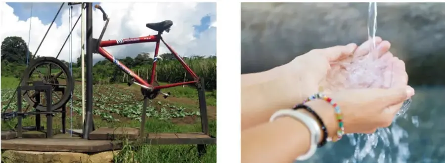 Fotografía de un prototipo o maqueta de un sistema de riego/bombeo de agua impulsado por una bicicleta instalada en un campo agrícola.