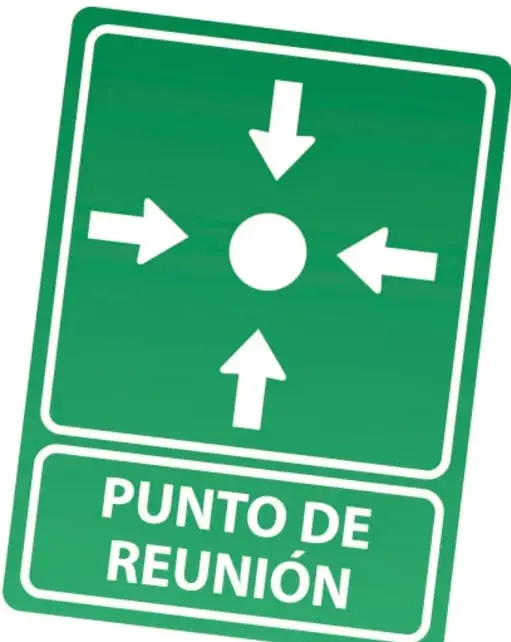Señal verde cuadrada con cuatro flechas blancas que apuntan a un círculo central y el texto 'PUNTO DE REUNIÓN'.