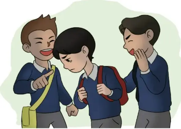 Dos estudiantes se burlan y señalan a un compañero que camina con la cabeza baja.