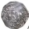 Fotografía del anverso de una macuquina Felipe II de 1 Real de México, plata, con ficha del Museo Numismático Nacional.